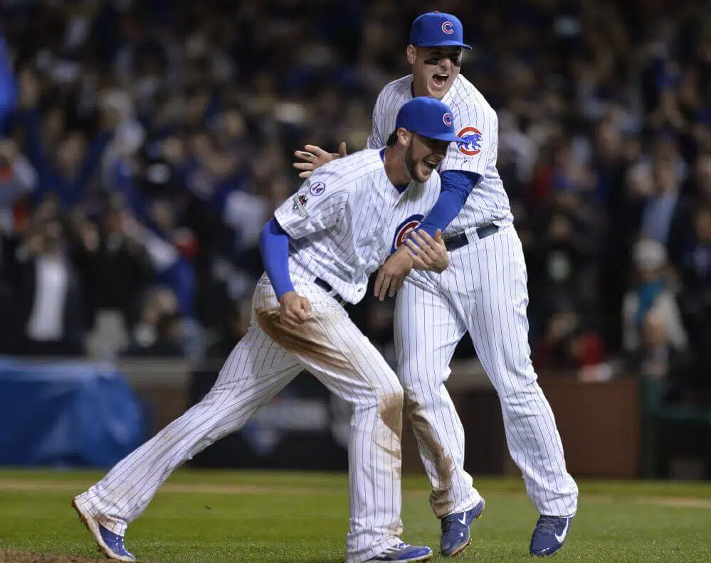 Chicago Cubs' Kris Bryant and Anthony Rizzo celebrate after winning Game 4 in baseball's National League Division Series, Tuesday, Oct. 13, 2015, in Chicago. The Cubs won 6-4. 